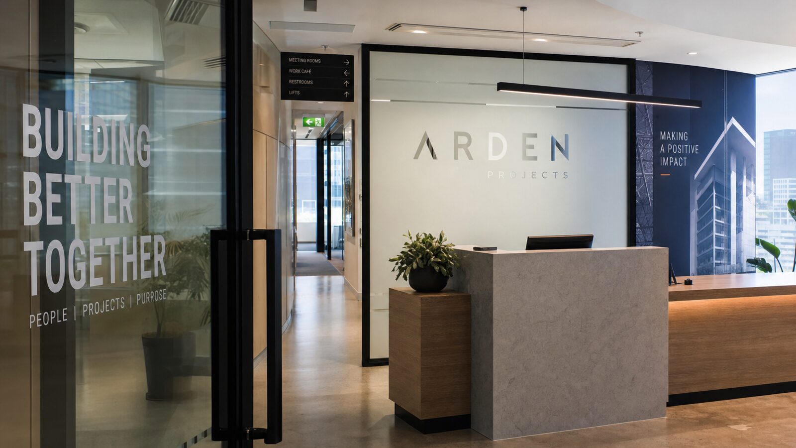 Modern Sydney office reception with signage, frosting and wayfinding all visible