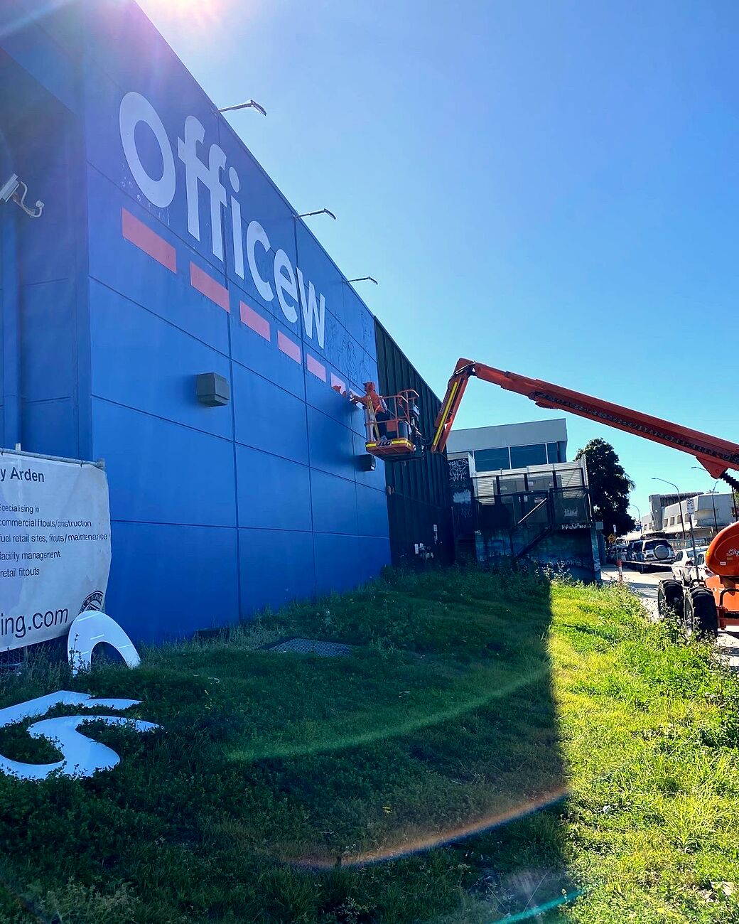 Cherry-picker mounted install of giant Officeworks exterior signage