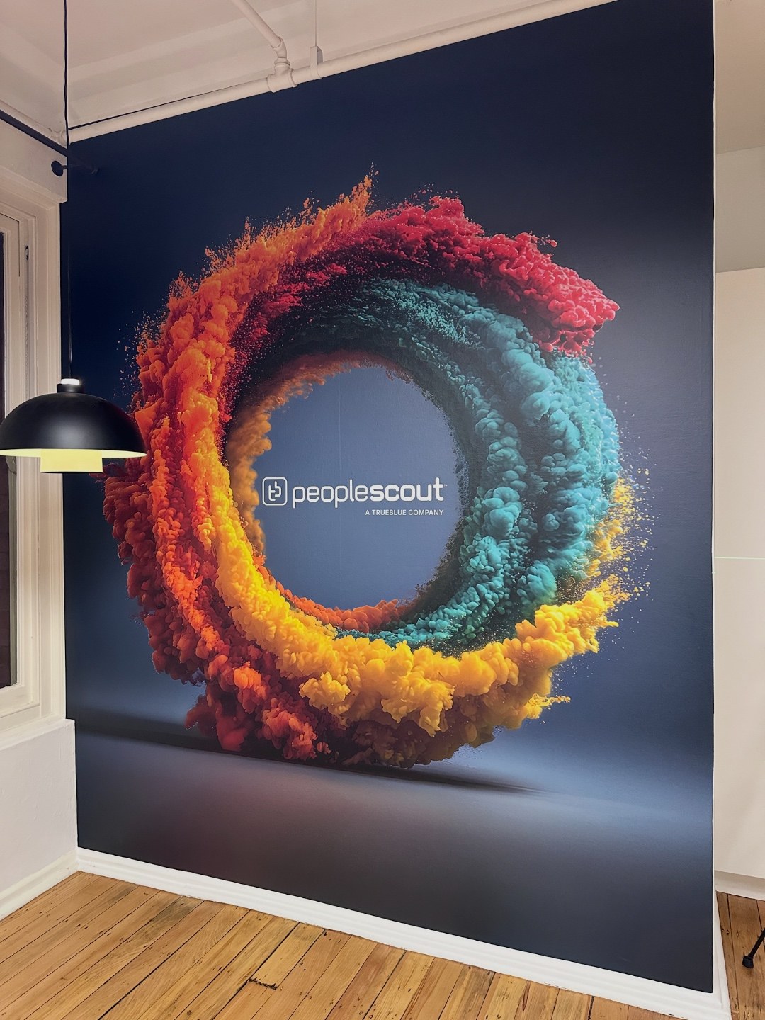 Floor-to-ceiling photographic PeopleScout brand mural in a heritage office