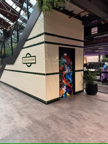 'The Platform' London-Underground style roundel and graffiti-art door at a workplace cafe