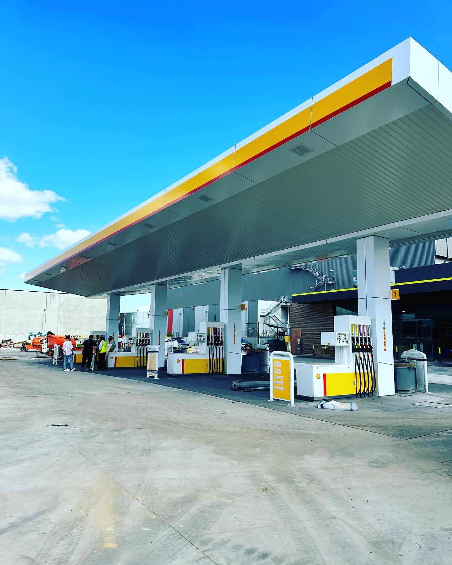Shell service station canopy with yellow and red brand identity